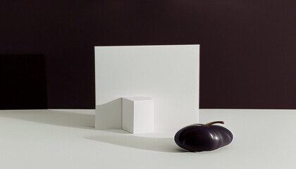 White box , black apple with white table, black background 