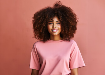 portrait of a curly afro woman with pink clothes.