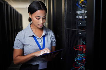 Woman, tablet and server room, programming or coding for cybersecurity, information technology or data protection backup. Engineering person on digital software, hardware inspection or basement check - obrazy, fototapety, plakaty