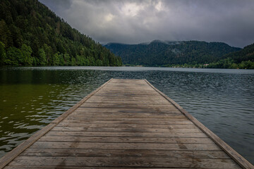 A pier in the French lake called 'longemer', a lake in the French Vosges at an altitude of over 700 meters. Suitable for fishing and water sports