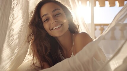 Portrait of a beautiful Moroccan girl in a white light oriental interior, bedroom.