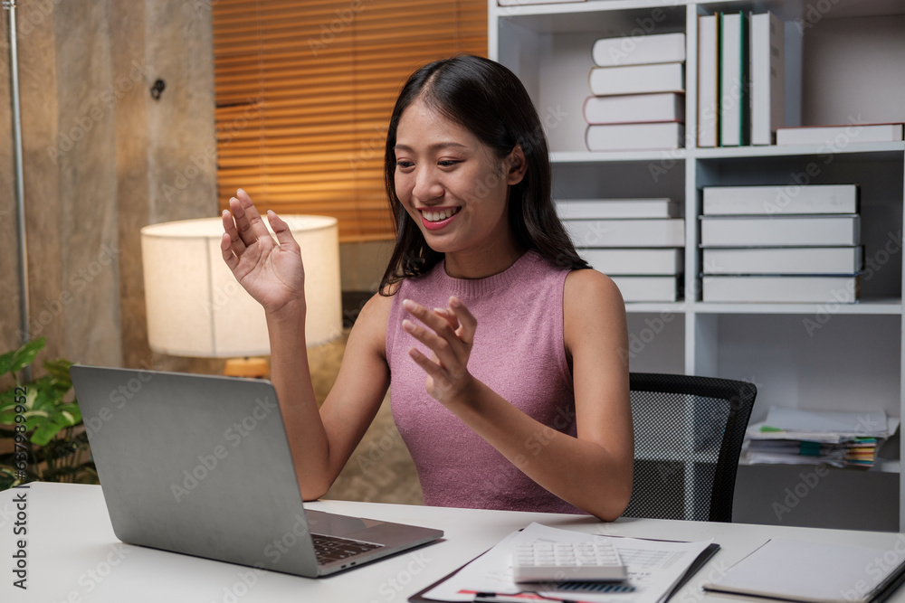Poster asian female student studying via video conferencing system while at home.