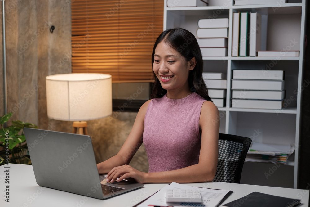 Poster asian female student studying via video conferencing system while at home.