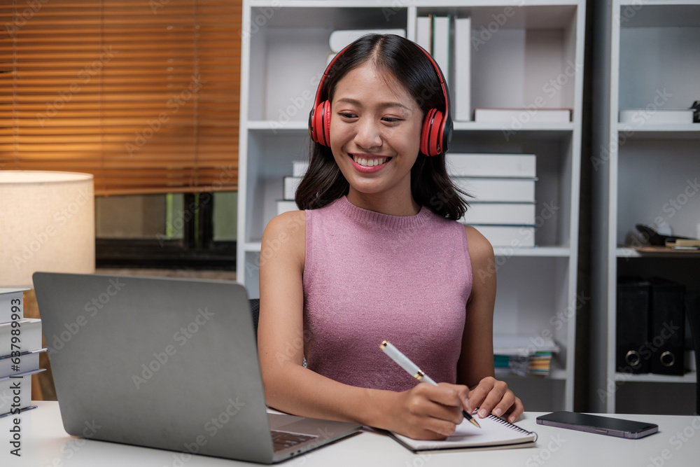 Aufkleber asian female student studying via video conferencing system while at home.