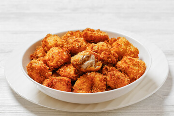 crispy fried panko breaded chicken bites in bowl