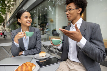 Business partners having coffee together