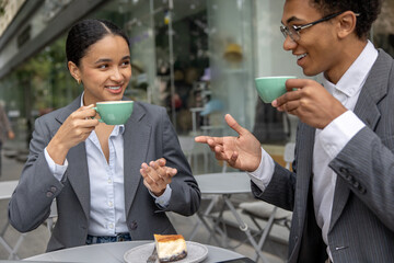 Business partners having coffee together