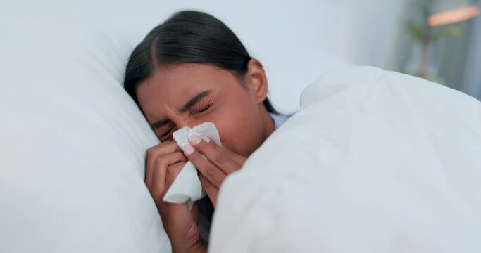 Bed, sick and woman with tissue, virus and illness with bacteria, health issue and sneeze. Person, diagnosis and girl in a bedroom, coughing and home with a blanket, flu season and tired with fatigue