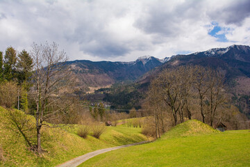 Fototapeta na wymiar The early spring alpine landscape around the village of Mione in Carnia, Udine Province, Friuli-Venezia Giulia, north east Italy