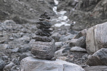 Stones stacked on top of each other in a mountain landscape of Norway