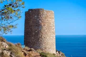 Mediterranean coastal landscape. Historic Torre Vigia De Cerro Gordo, a watchtower looking out for any marauding pirates. La Herradura, Andulasia, Southern Spain