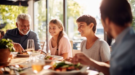 Happy multi-generation family having fun during a lunch
