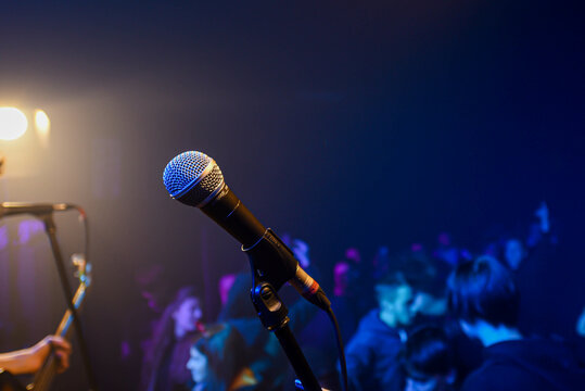 Public performance on stage Microphone on stage against a background of auditorium. Shallow depth of field. Public performance on stage. High quality photo