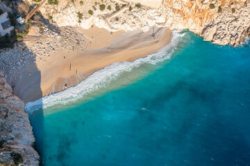 Relaxing aerial beach, summer vacation tropical Mediterranean landscape. Peaceful beach, seaside surf. Waves surf amazing blue ocean lagoon, shore coastline. Beautiful aerial drone top view.