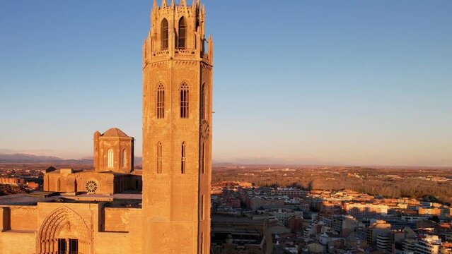 Panoramic aerial drone view of old medieval 13th century Cathedral of St Mary Cloister and tower of la Seu Vella is symbol of reconquista, iconic monument in city of Lleida, Catalonia, Spain.4K video