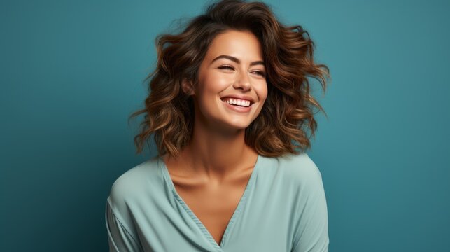 pretty woman laughing on a colorful background