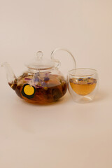 FlowersTea pot with a cup of tea in isolated background