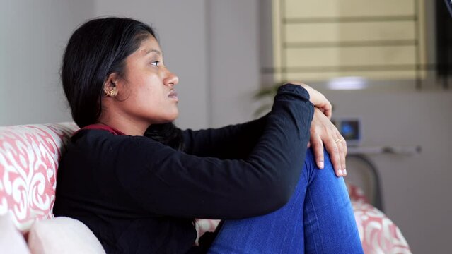 Dejected Woman Sitting on Sofa