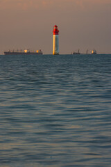 Fototapeta premium Phare de Chauvea near Ile de Re with ships to La Rochelle, Pays de la Loire, France