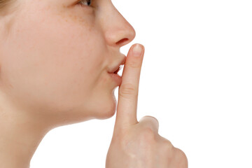 Closeup profile of woman making shh sign isolated on white background