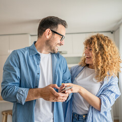 Happy adult caucasian couple at home husband and wife family concept