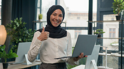 Islamic muslim businesswoman smiling Arabian Indian woman in hijab female manager stand working...