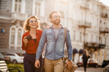 man and woman on romantic vacation walking together