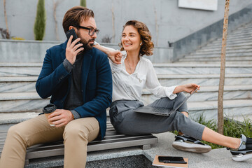 man and woman business partners working together