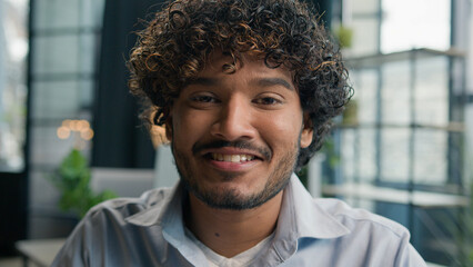 Head shot portrait Latino hispanic businessman Arabian Indian guy looking at camera happy smiling male multiethnic man office manager employer worker student dental toothy smile in business company