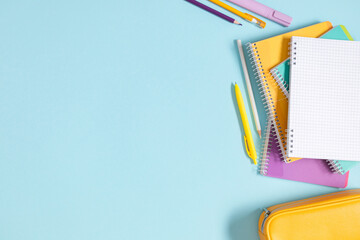 Back to school background. Flat lay, top view of school accessories, notebook, pens on isolated...