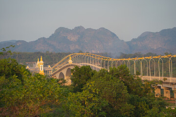 Thai Laos bridge with Mekong River with green mountain hill. Nature landscape background in Nong...