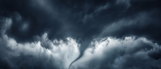 The typhoon is born, a tornado in a stormy dark sky with black clouds and a strong wind. Concept on...