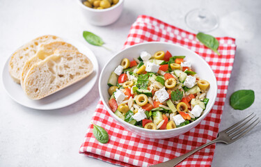 Spinach cucumber pepper orzo salad in a bowl