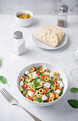 Spinach cucumber pepper orzo salad in a bowl