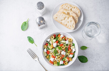 Spinach cucumber pepper orzo salad in a bowl