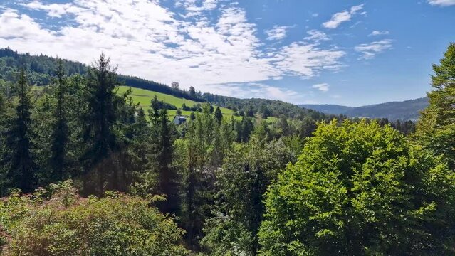 View on the Vistula valley and the peaks of Silesian Beskid on a sunny summer day.  tourist town Wisla, Poland. timelapse