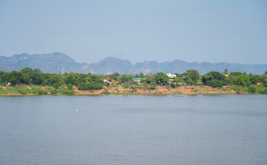 Fototapeta na wymiar Aerial view of Mekong River with green mountain hill. Nature landscape background in Ubon Ratchathani, Thailand and Laos.