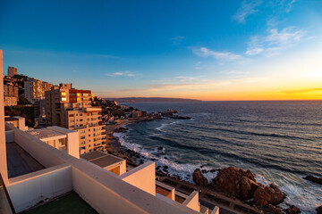 sunset in the city beach Cochoa,  Re&ntilde;aca Vina del Mar beach, Valparaiso, Chile