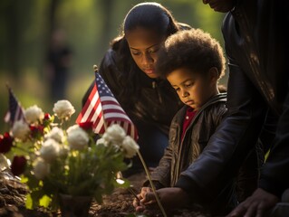 A touching scene as families lay flowers at a United States flag-adorned memorial