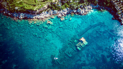 Top down aerial view of sunken ship Boka, lying on the sea bottom at the town of Orebic, Croatia,...