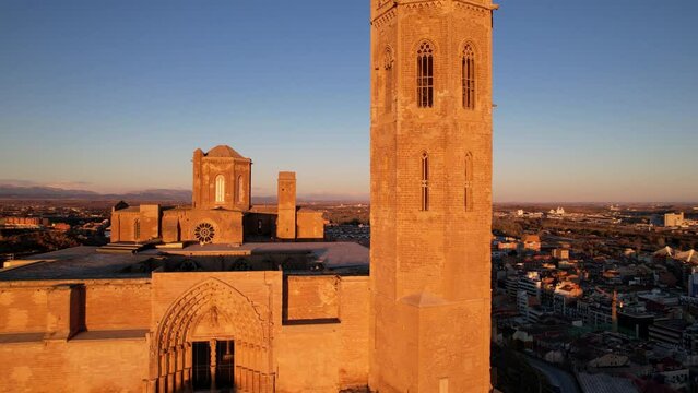 Panoramic aerial drone view of old medieval 13th century Cathedral of St Mary Cloister and tower of la Seu Vella is symbol of reconquista, iconic monument in city of Lleida, Catalonia, Spain. 4K video