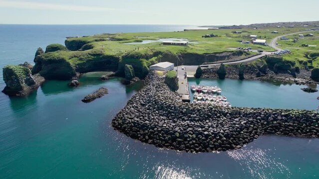 Arnastapi fishing village with white house and mount Stapafell on coastline in Snaefellsnes peninsula