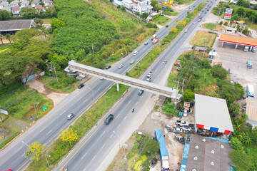 Aerial view of cars driving on highway junction or moterway. Overpass bridge street roads in connection network of architecture concept. Top view. Urban city, Bangkok, Thailand.