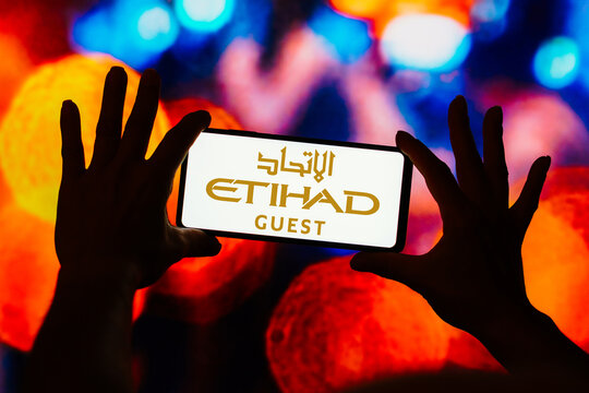 August 22, 2023, Brazil. In this photo illustration, the Etihad Guest (Etihad Airways) logo seen displayed on a smartphone.