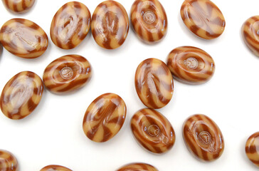 Caramel candies isolated on white background