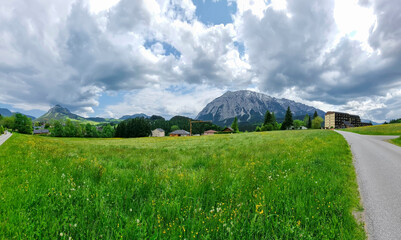 Summer austrian landscape with Grimming mountain (2.351 m), an isolated peak in the Dachstein Mountains, view from small alpine village Tauplitz, Styria, Austria