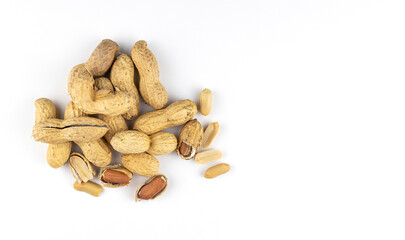 Raw peanuts on a white background, top view. Unshelled peanuts.