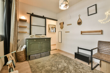 a living room with an area rug on the floor and a wooden bench in front of the wall mounted mirror