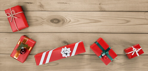 Obraz premium Banner with Christmas gifts wrapped in red paper. A classic gift box packaging idea. Personalized Present. Preparing for Christmas and New Year. Header for advertising, website, blog, shop.