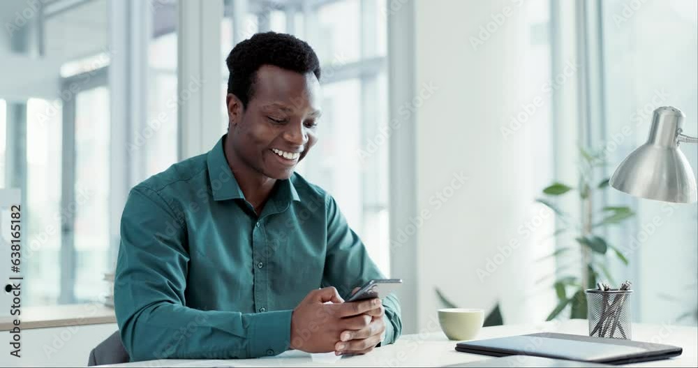 Wall mural Business man, funny phone text and desk with a smile from social media and networking at work. Happy, African male professional and employee meme web app with online communication and planning